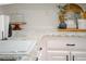 Modern kitchen featuring granite countertops, stylish decor, and white subway tile backsplash at 503 Hearthstone Rdg, Woodstock, GA 30189
