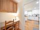 Kitchen nook features wooden desk, storage cabinets, and an open view to the kitchen at 503 Hearthstone Rdg, Woodstock, GA 30189