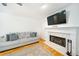 Bright living room featuring a marble fireplace, TV, and comfortable gray sofa at 503 Hearthstone Rdg, Woodstock, GA 30189