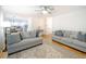 Open concept living room with hardwood floors, neutral decor, and a view of the kitchen at 503 Hearthstone Rdg, Woodstock, GA 30189
