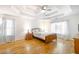 Bright main bedroom with hardwood floors, tray ceiling, and plenty of natural light at 503 Hearthstone Rdg, Woodstock, GA 30189