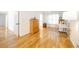 Bright bonus area featuring hardwood floors, a desk and a five-drawer dresser at 503 Hearthstone Rdg, Woodstock, GA 30189