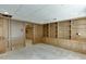 Basement room with wood paneled walls, built-in shelving, and carpet flooring at 7660 Dunvegan Close, Sandy Springs, GA 30350