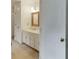 Bathroom featuring sink, countertop, mirror, and plenty of cabinet space for storage at 7660 Dunvegan Close, Sandy Springs, GA 30350