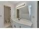 Bathroom featuring vanity, countertop, and cabinet, and commode in background at 7660 Dunvegan Close, Sandy Springs, GA 30350