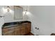 Bathroom featuring a dark granite countertop and classic vanity at 7660 Dunvegan Close, Sandy Springs, GA 30350