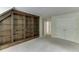 Spacious bedroom with built-in wooden shelving and a large closet at 7660 Dunvegan Close, Sandy Springs, GA 30350
