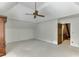 Bedroom with carpet, trim detail, ample room, and a doorway leading to the stairs at 7660 Dunvegan Close, Sandy Springs, GA 30350
