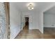 Inviting foyer with hardwood floors, detailed trim, and elegant lighting fixture at 7660 Dunvegan Close, Sandy Springs, GA 30350