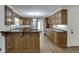 Updated kitchen with dark countertops, custom cabinets, stainless steel appliances, and hardwood floors at 7660 Dunvegan Close, Sandy Springs, GA 30350