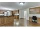 Bright kitchen featuring custom wood cabinets, island with bar, granite countertops, and stainless steel appliances at 7660 Dunvegan Close, Sandy Springs, GA 30350