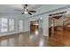 Inviting living room featuring hardwood floors and open access to the kitchen and other living spaces at 7660 Dunvegan Close, Sandy Springs, GA 30350