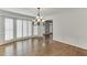 Bright living room with hardwood floors, plantation shutters and decorative wall trim at 7660 Dunvegan Close, Sandy Springs, GA 30350