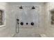 Walk-in shower with dual showerheads and a hand-held showerhead in a tile surround at 7660 Dunvegan Close, Sandy Springs, GA 30350