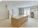 Walk-in closet featuring custom shelving, an island dresser, and natural lighting at 7660 Dunvegan Close, Sandy Springs, GA 30350