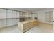 Spacious walk-in closet with custom shelving, cabinets, and an island dresser at 7660 Dunvegan Close, Sandy Springs, GA 30350