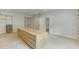 Large walk-in closet with custom shelving and an island dresser at 7660 Dunvegan Close, Sandy Springs, GA 30350