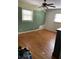 Primary bedroom with hardwood floors and two windows at 2433 Tilson Rd, Decatur, GA 30032