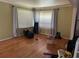 Sun-filled living room with hardwood floors and double windows at 2433 Tilson Rd, Decatur, GA 30032