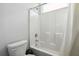 Bathroom featuring a shower and tub combination with white tile surround at 2646 Neighborhood S Walk, Villa Rica, GA 30180