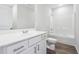 Bathroom featuring a shower and tub combination with white tile surround and vanity at 2646 Neighborhood S Walk, Villa Rica, GA 30180