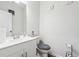 Clean bathroom featuring white vanity, toilet, and ample space for storage at 2646 Neighborhood S Walk, Villa Rica, GA 30180