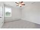 Bedroom featuring neutral carpet, a ceiling fan, and a bright window at 2646 Neighborhood S Walk, Villa Rica, GA 30180
