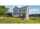 Attractive two-story home with well-kept lawn, landscaping and paved driveway leading to a garage at 2646 Neighborhood S Walk, Villa Rica, GA 30180