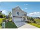 Well-maintained two-story home with front porch, brick accents and a two-car garage at 2646 Neighborhood S Walk, Villa Rica, GA 30180