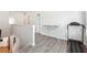 Upstairs hallway with luxury vinyl plank floors plus fitness equipment at 2646 Neighborhood S Walk, Villa Rica, GA 30180