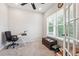 Home office with natural light, neutral walls, carpeted floors, and a contemporary desk and chair setup at 2646 Neighborhood S Walk, Villa Rica, GA 30180