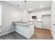 Modern kitchen features white cabinets, granite countertops, and stainless steel appliances at 2646 Neighborhood S Walk, Villa Rica, GA 30180