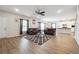 Spacious living room features wood floors and comfortable seating with an open concept floor plan at 2646 Neighborhood S Walk, Villa Rica, GA 30180