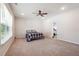 Large main bedroom with ample natural light and plush carpeting at 2646 Neighborhood S Walk, Villa Rica, GA 30180