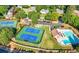 Aerial view of community tennis courts and pool; an amenity of the neighborhood at 3330 Arborwoods Dr, Alpharetta, GA 30022