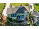 Backyard aerial featuring an enclosed porch, manicured landscaping, a patio, and a large roof at 3330 Arborwoods Dr, Alpharetta, GA 30022
