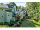 Aerial view of a home highlighting the enclosed porch, landscaped yard, and multi-level layout at 3330 Arborwoods Dr, Alpharetta, GA 30022