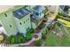 Aerial view of the rear of the house, showing the deck, enclosed porch, landscaping, and patio at 3330 Arborwoods Dr, Alpharetta, GA 30022