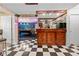 Finished basement bar with tile flooring and decorative lighting at 3330 Arborwoods Dr, Alpharetta, GA 30022