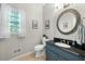 Bathroom features a vanity and a decorative mirror at 3330 Arborwoods Dr, Alpharetta, GA 30022