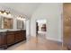 Open bathroom layout with double vanity, tiled floors, and access to the bedroom and shower area at 3330 Arborwoods Dr, Alpharetta, GA 30022