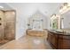 Luxurious bathroom with double sink vanity, tub, separate shower, and tile flooring at 3330 Arborwoods Dr, Alpharetta, GA 30022
