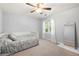 Neutral bedroom features a ceiling fan, daybed and sunny window at 3330 Arborwoods Dr, Alpharetta, GA 30022