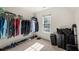 Functional closet with clothing racks, luggage storage, and natural light from a window at 3330 Arborwoods Dr, Alpharetta, GA 30022