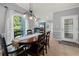 This dining room has an abundance of natural light and access to the kitchen at 3330 Arborwoods Dr, Alpharetta, GA 30022