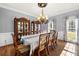 Elegant dining room with hardwood floors, chandelier, and classic furniture at 3330 Arborwoods Dr, Alpharetta, GA 30022
