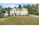 Beautifully landscaped front yard and a two-story home with inviting curb appeal at 3330 Arborwoods Dr, Alpharetta, GA 30022