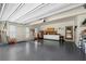Spacious garage with epoxy floor, storage cabinets and shelving, providing ample space for vehicles and tools at 3330 Arborwoods Dr, Alpharetta, GA 30022