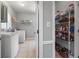 Conveniently located laundry room with a pantry at 3330 Arborwoods Dr, Alpharetta, GA 30022
