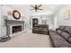 Inviting living room featuring a fireplace, comfortable seating, and access to sunroom at 3330 Arborwoods Dr, Alpharetta, GA 30022